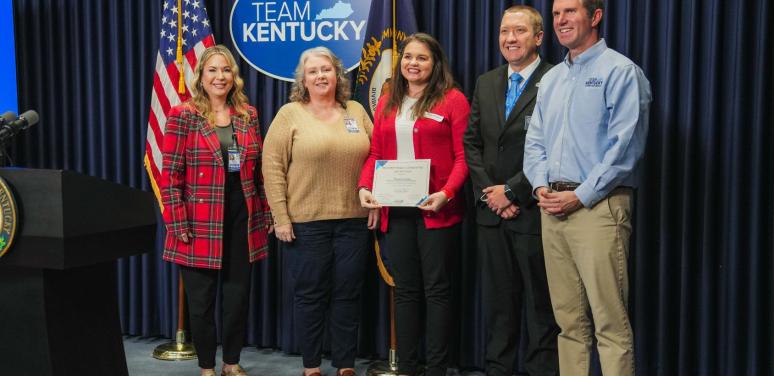 Floyd County Partners stand beside Governor Beashear at Team KY Update