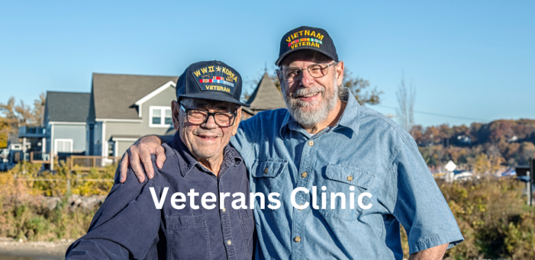 two older veterans holding a fishing pole