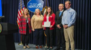 Floyd County Partners stand beside Governor Beashear at Team KY Update